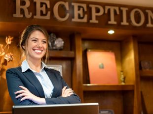 woman at reception hospitality-management