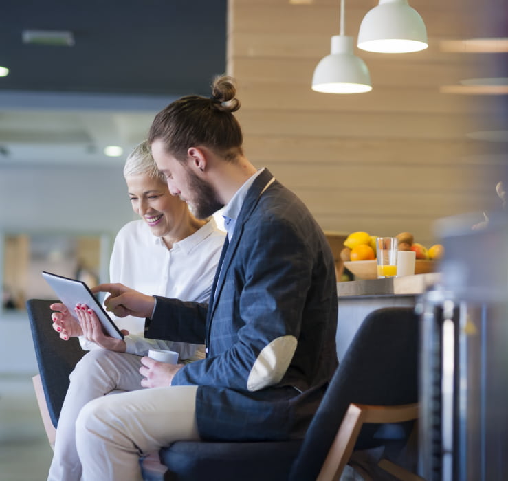people looking at a tablet