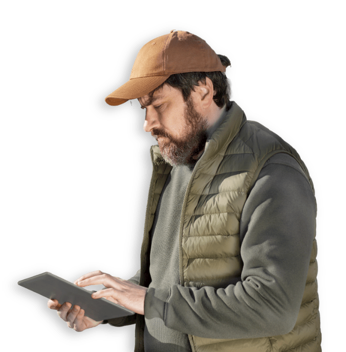 man with hat and tablet