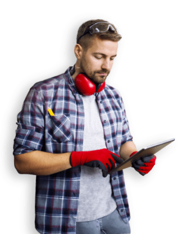 man with hearing protection and laptop